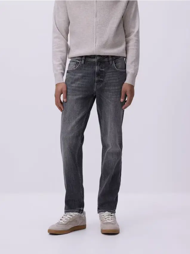 Jeans slim con effetto slavato - grigio