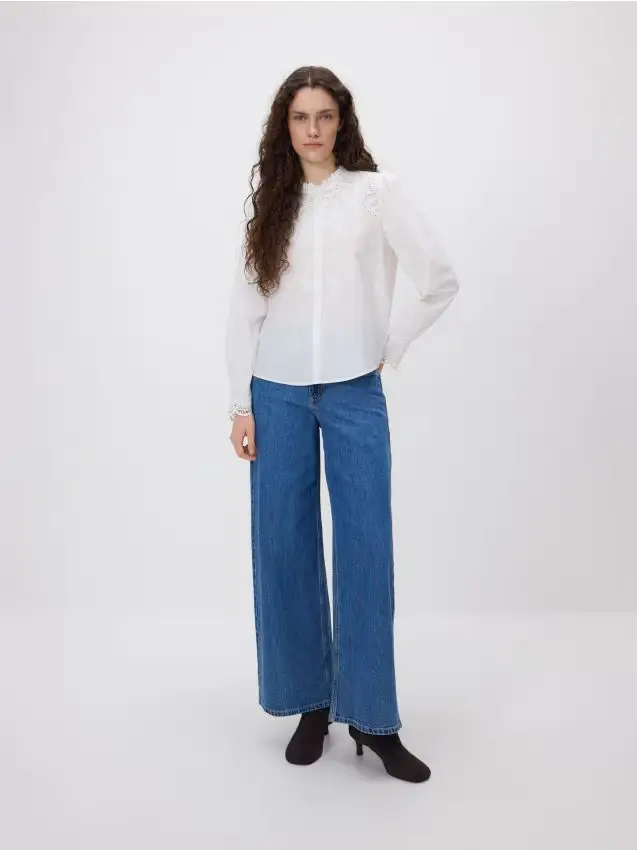 Jeans wide leg con impunture - blu