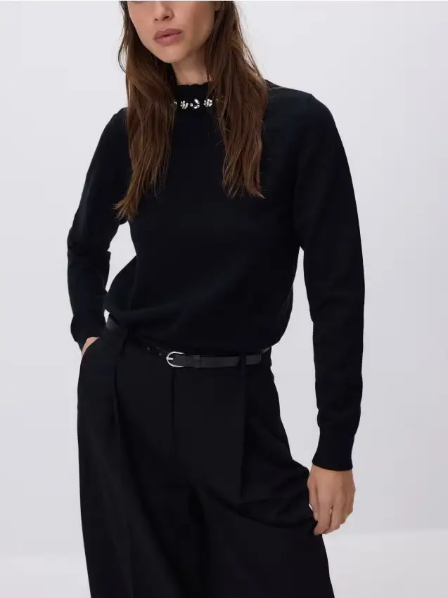 Maglione con applicazione decorativa - nero