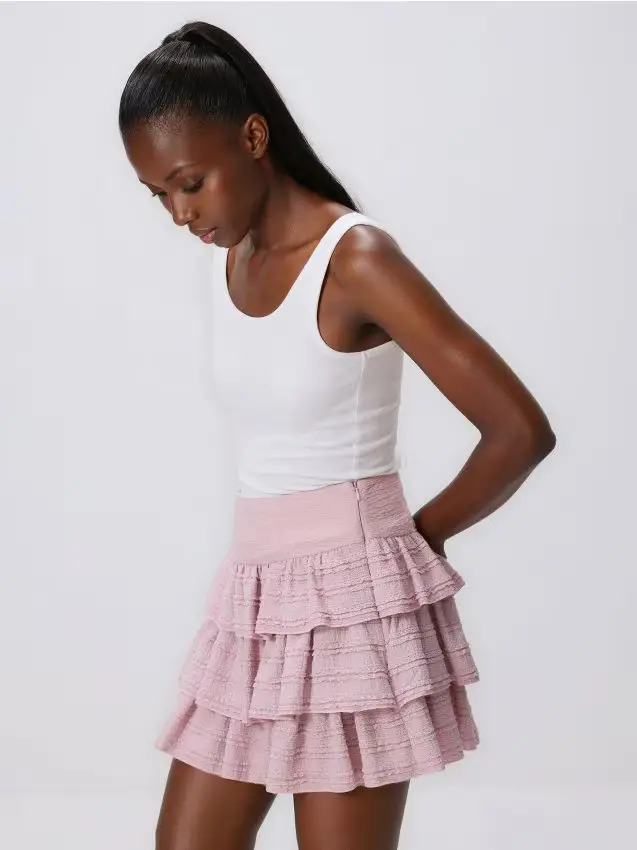 Minigonna con volant - rosa pastello
