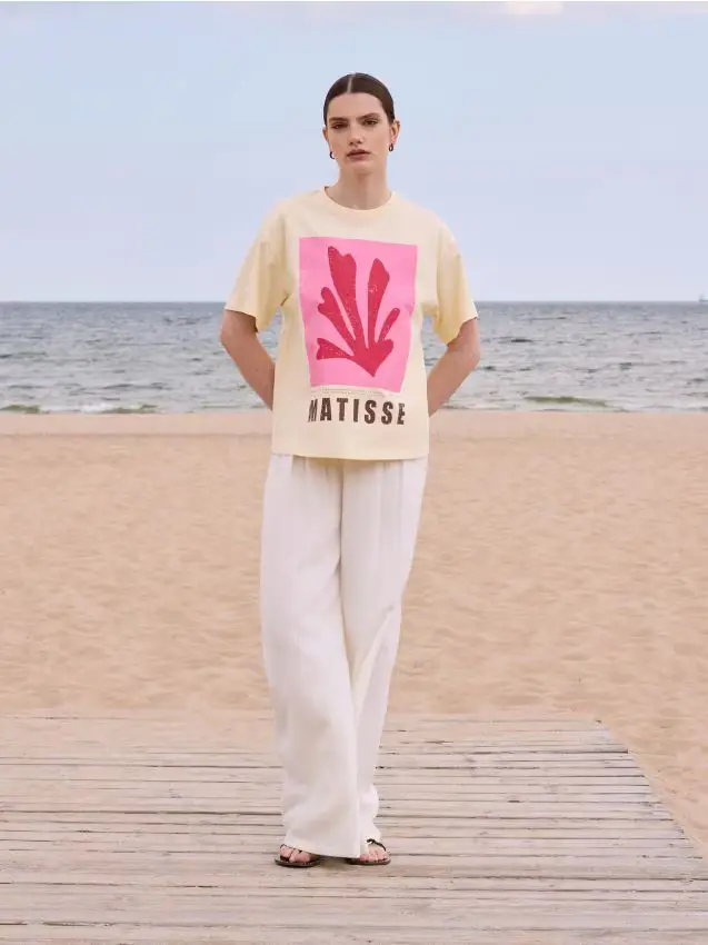 Pantaloni ampi con catena - panna