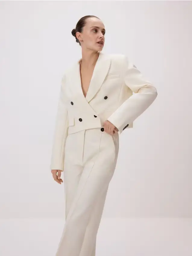 Pantaloni con piega stirata - panna