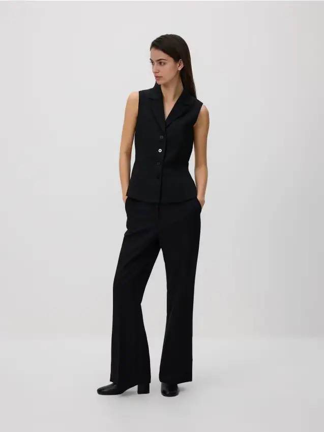 Pantaloni con strappi - nero