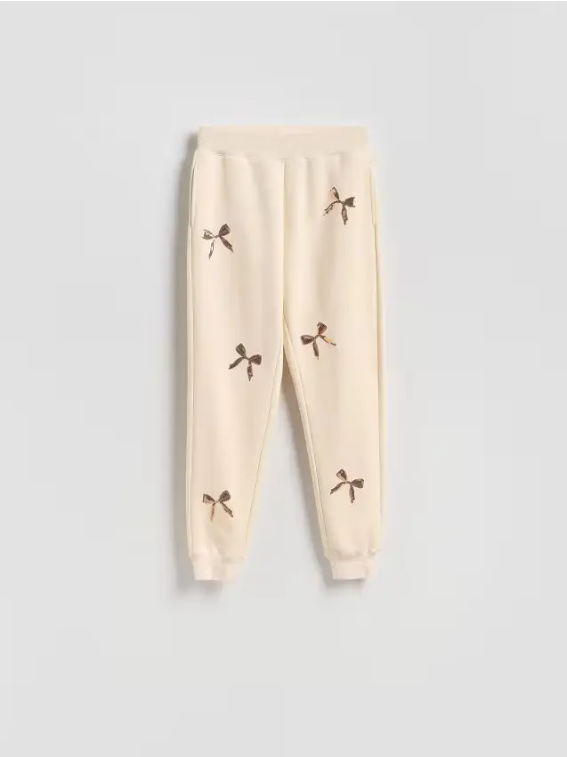 Pantaloni da tuta con applicazioni - panna