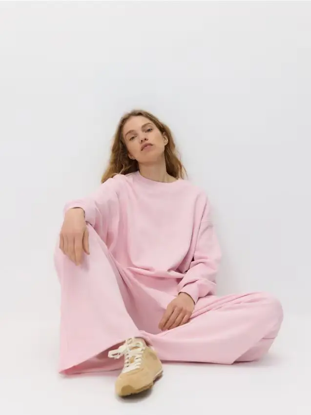 Pantaloni della tuta con gamba larga - rosa pastello