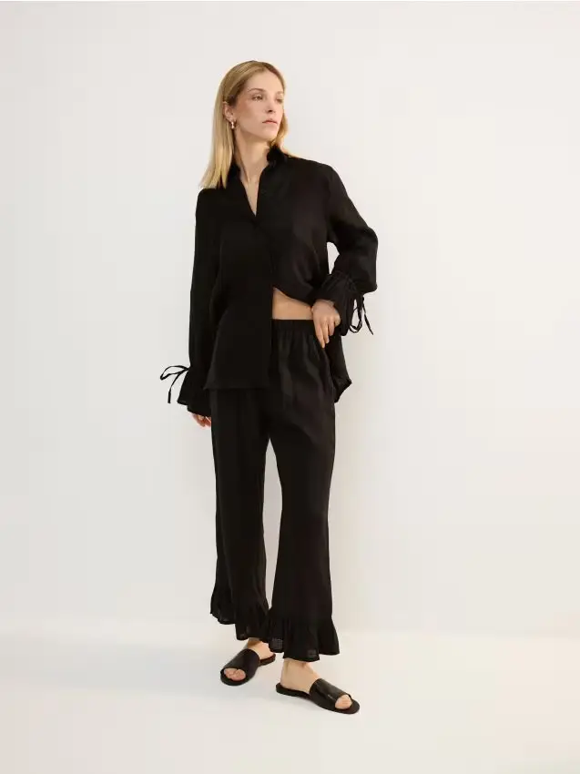 Pantaloni in lino con volant - nero