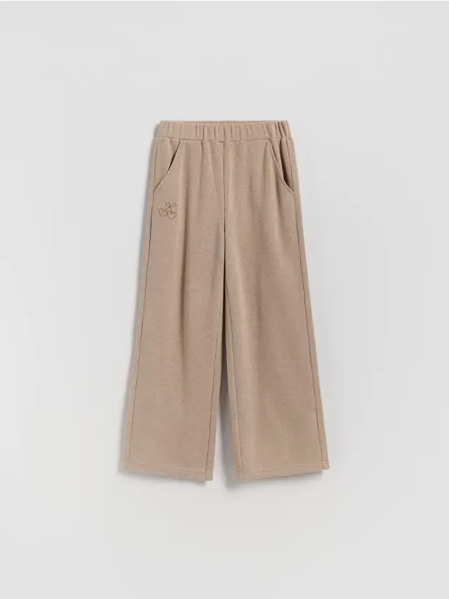 Pantaloni in maglia con ricamo - beige