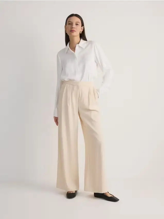 Pantaloni larghi con pinces - panna