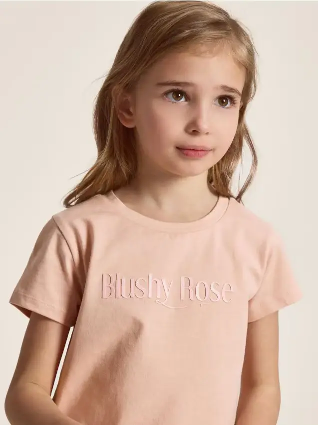 T-shirt con scritta in rilievo - rosa cipria