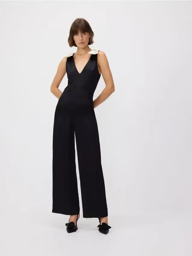 Tuta con fiocchi a contrasto - nero