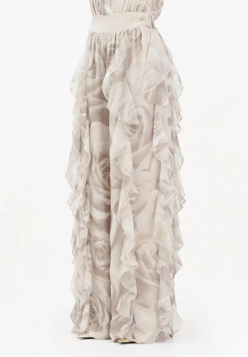 Pantalone elegante beige da donna con delicata stampa floreale