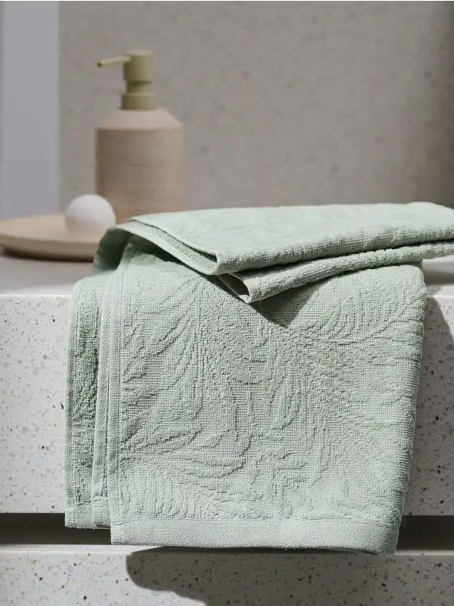 Asciugamano in cotone con motivo vegetale - verde pallido