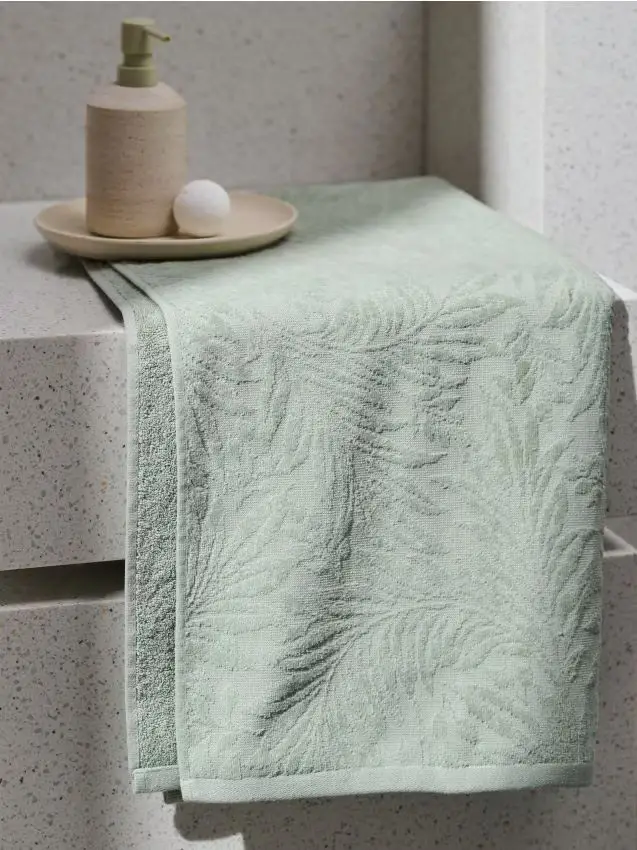 Asciugamano in cotone con motivo vegetale - verde pallido