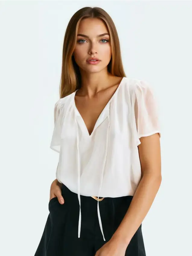 Blusa con maniche in tulle - bianco