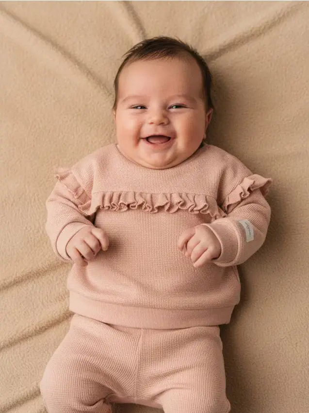 Blusa con volant - rosa pastello