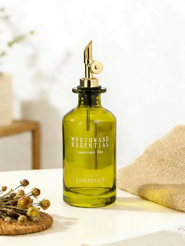 Bottiglia in vetro per collutorio con dosatore - verde pallido