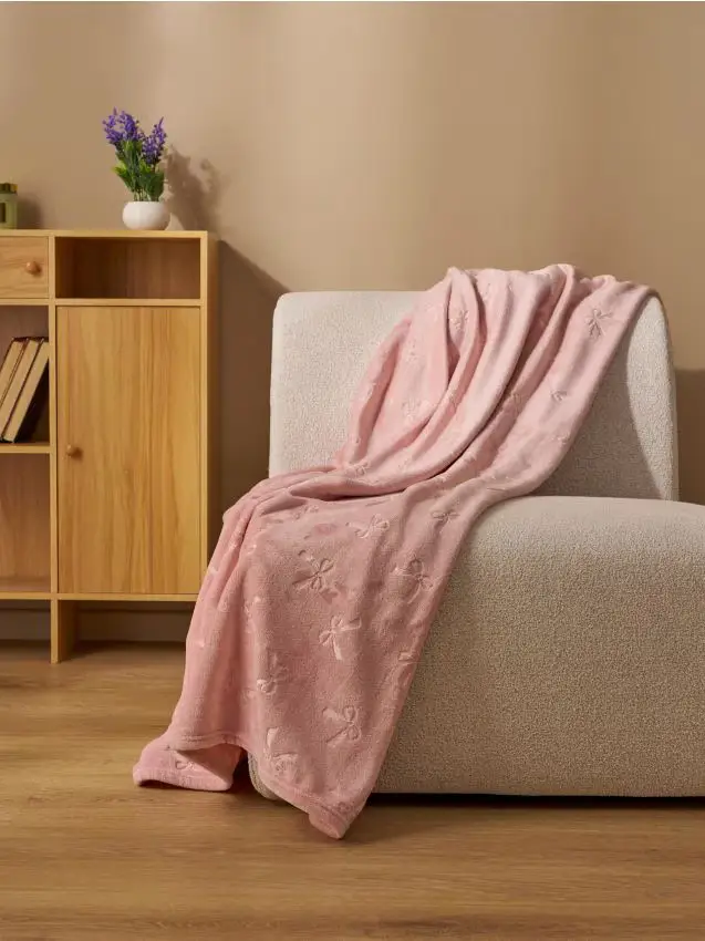 Coperta con fiocchi - rosa pastello