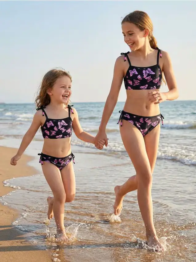 Costume da bagno con farfalle lucide e perline - nero