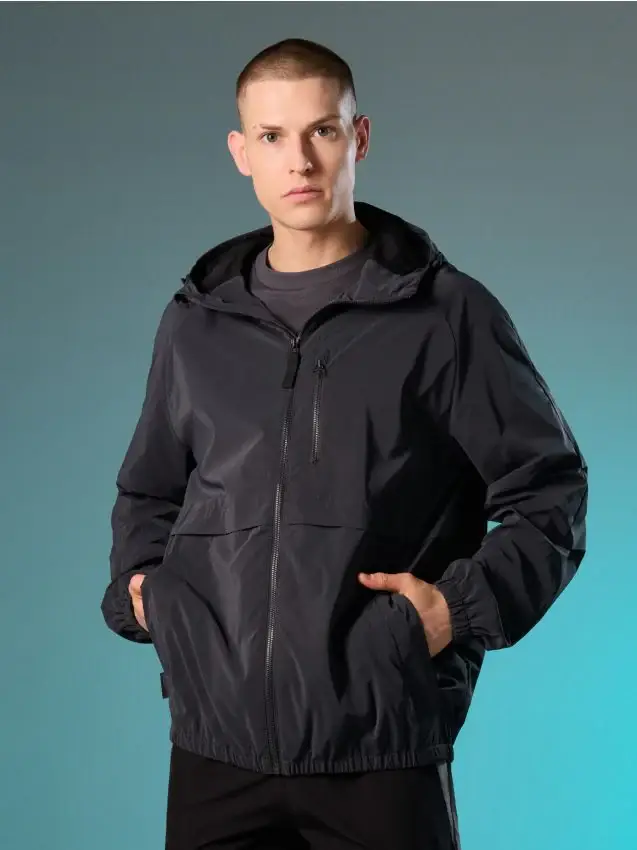 Giacca tecnica tipo windbreaker con cappuccio - grigio medio