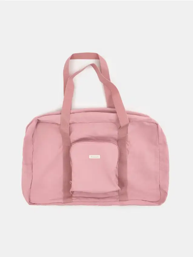Grande borsa da viaggio che si piega in una pochette - rosa cipria