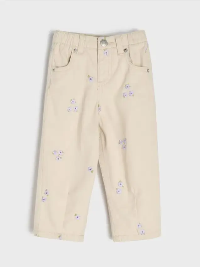 Jeans in cotone con fiori ricamati - beige