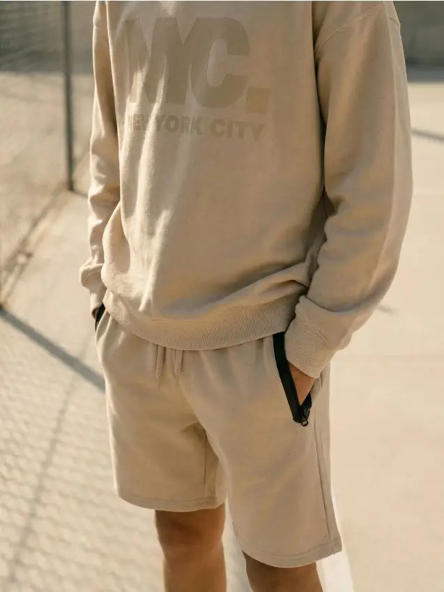 Pantaloncini con tasche con zip - beige