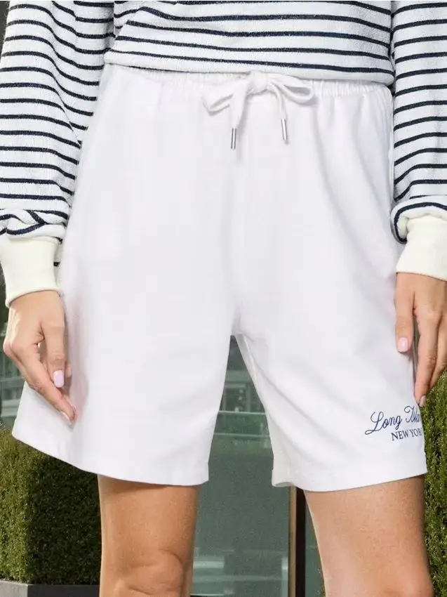 Pantaloncini sportivi con scritta - panna