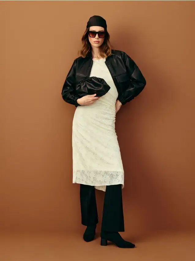 Pantaloni a zampa in maglia con cuciture - nero