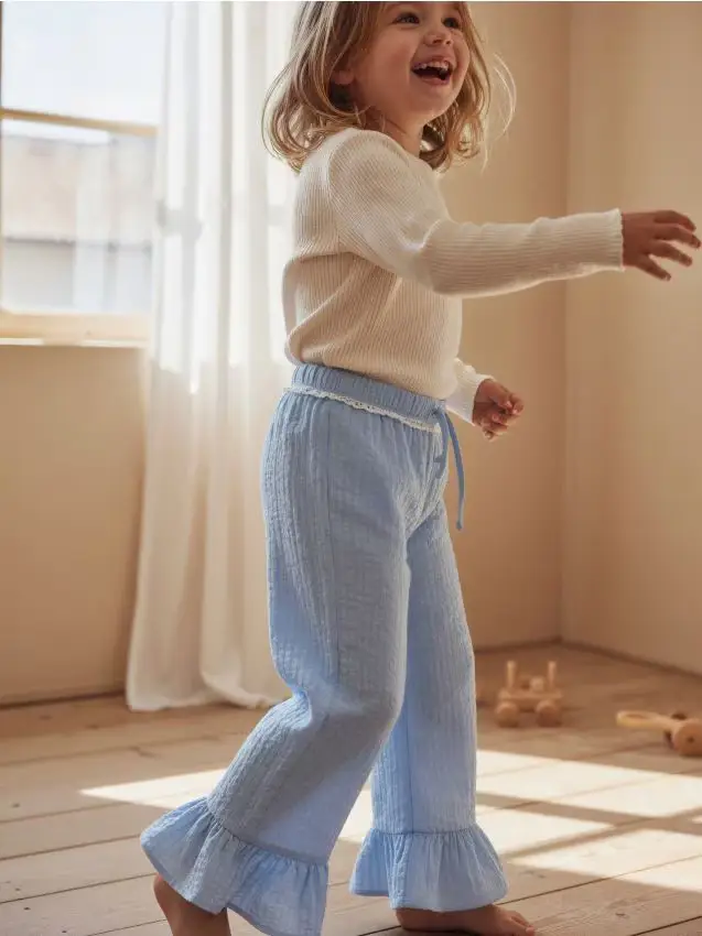 Pantaloni in tessuto con orlo a balza - azzurro