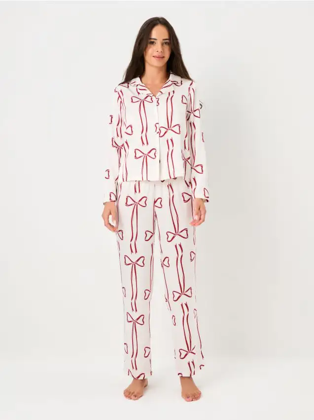 Pigiama a due pezzi con fiocchi rossi - panna