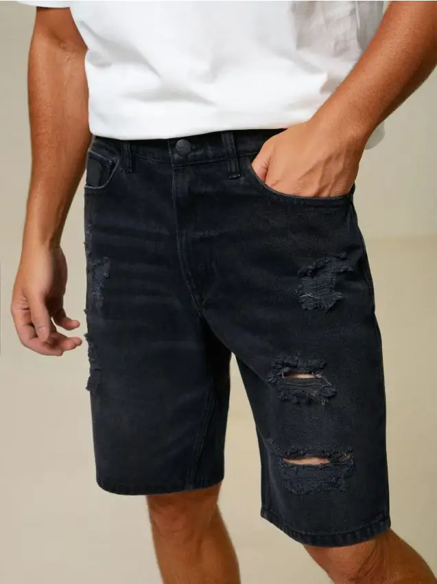 Shorts di jeans strappati - nero