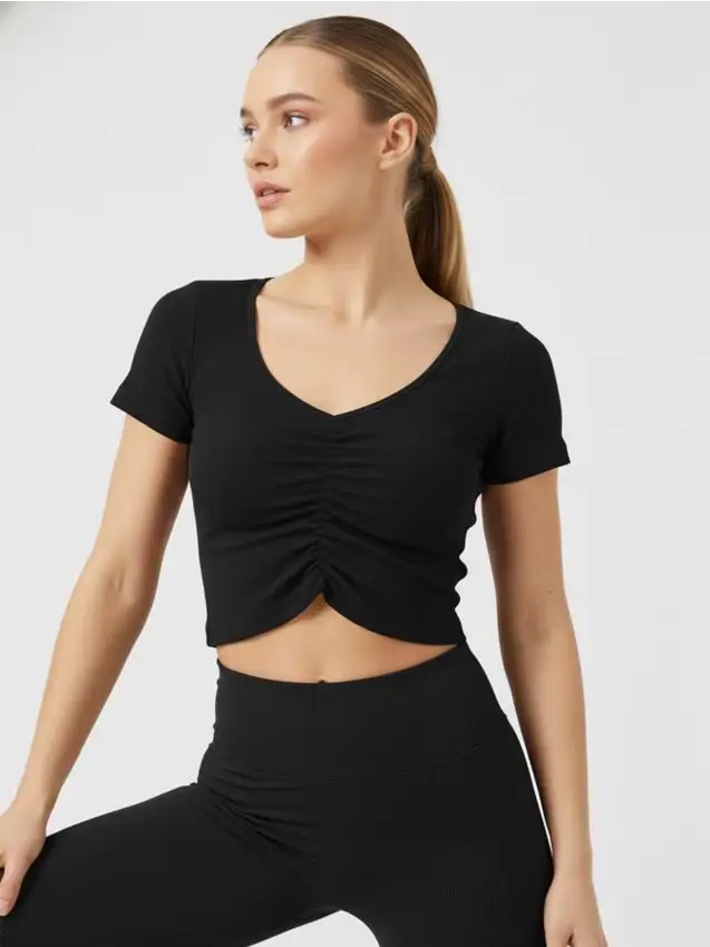 Top corto con arricciatura centrale - nero