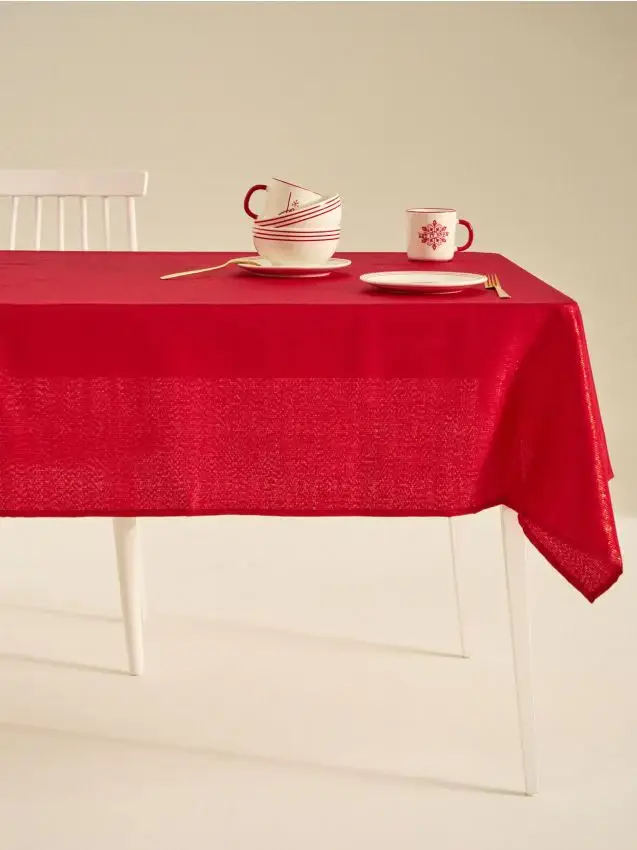 Tovaglia natalizia con un delicato luccichio dorato - rosso