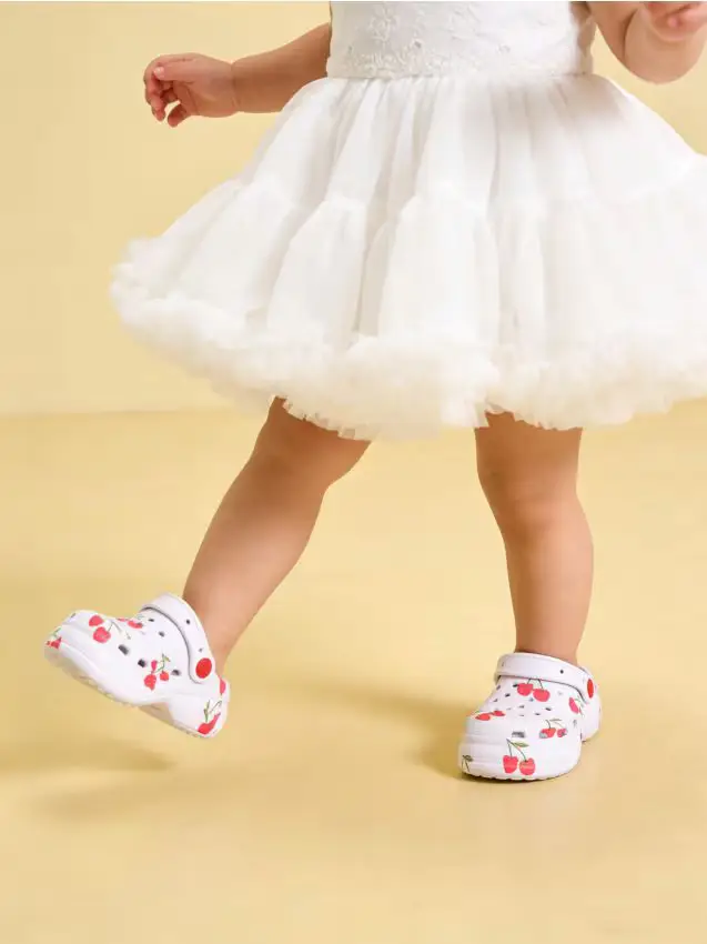 Zoccoli con cinturino sul tallone - bianco