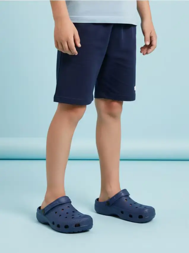 Zoccoli con cinturino sul tallone - indaco