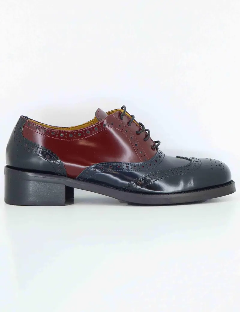 Stringate in pelle nera con impunture Donna SP9601 001