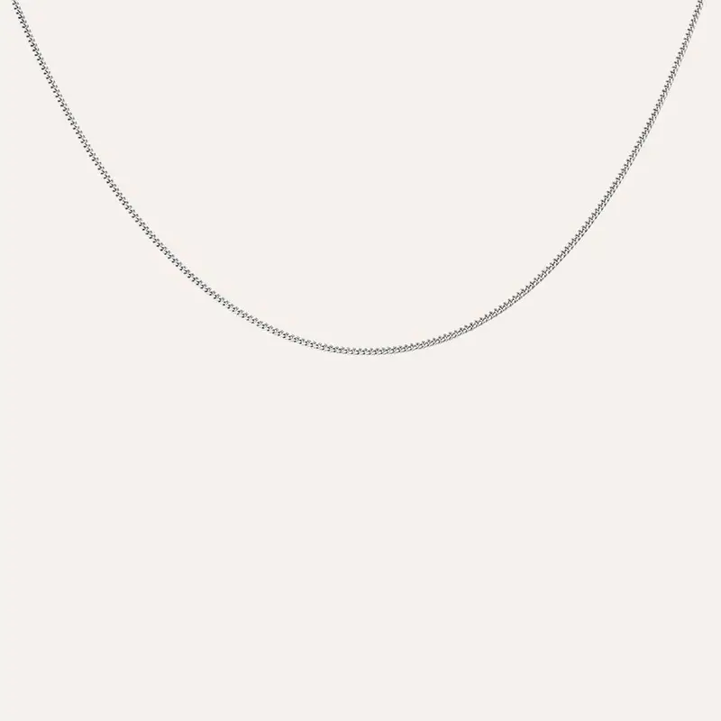 Ciondolo Croce in oro bianco e zirconi