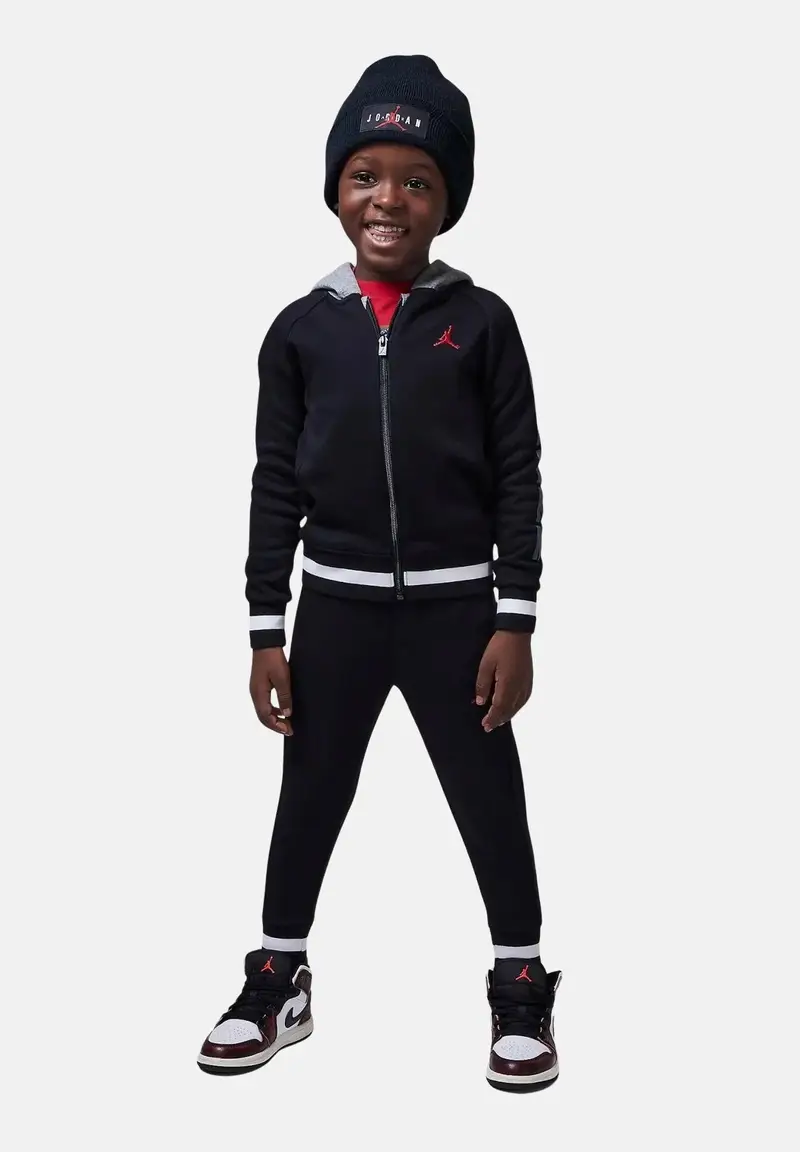 Tuta nera da bambino con dettagli a contrasto e logo