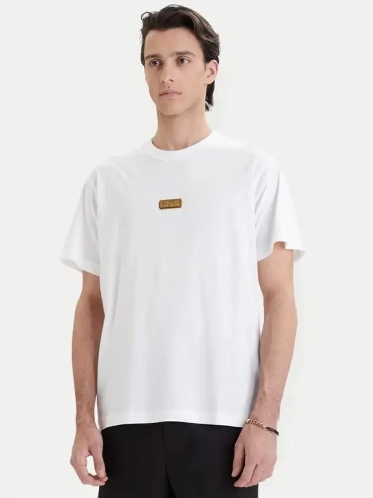 tshirt bianca con mini placca dorata centrale